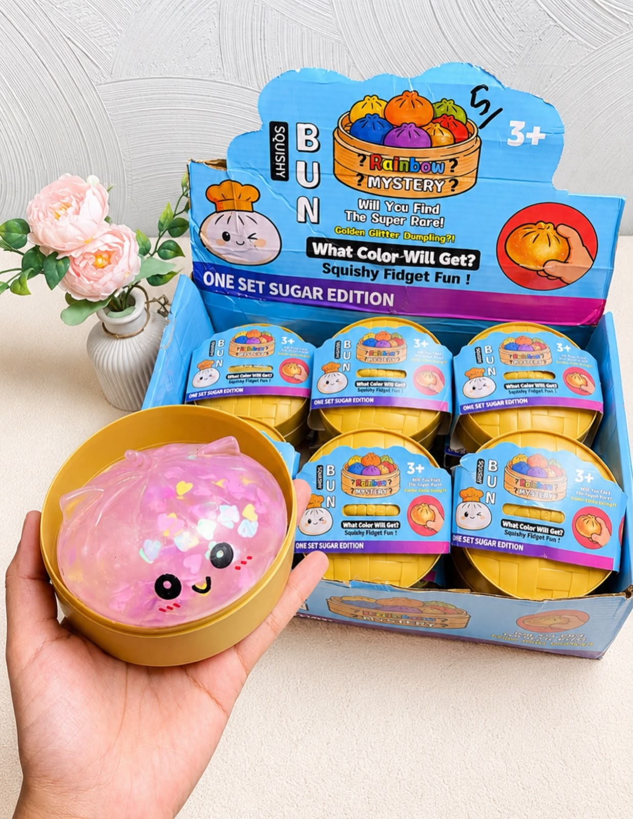 Squishy rosa com glitter e embalagem